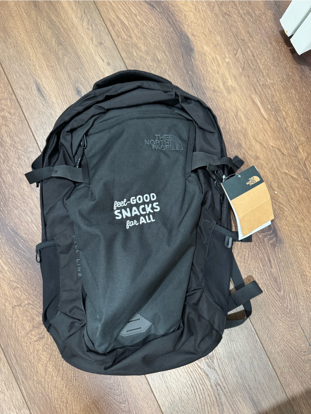 The North Face Black Backpack with 'Good Snacks For All' Graphic